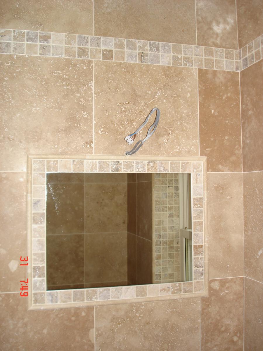 F&H Travertine 45x45 with a tumbled scabos mosaic border