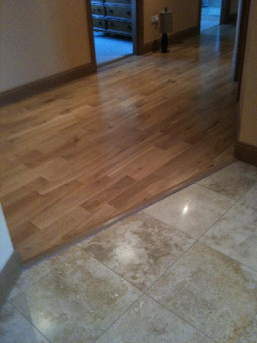 F&H Travertine entrance tile meeting solid oak flooring