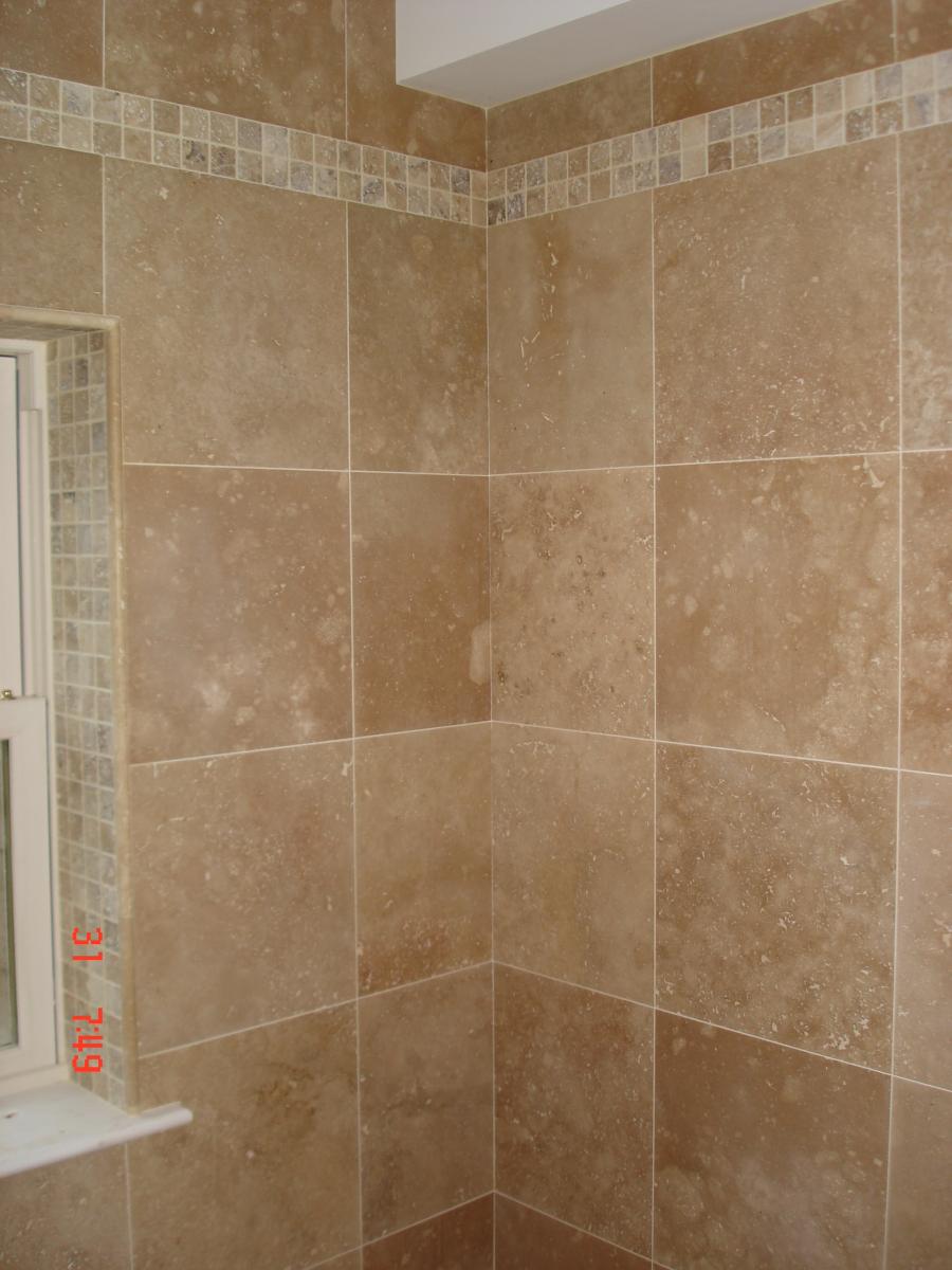 F&H Travertine  with a tumbled scabos mosaic border