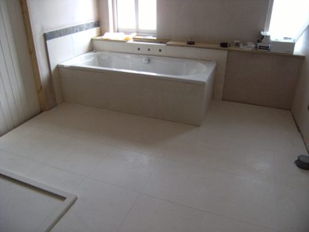 Floor tiled in honed limestone