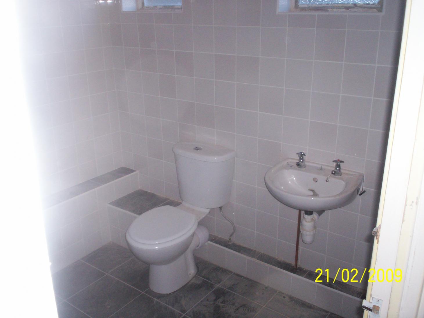 gray tiles and bathroom suite from B&Q