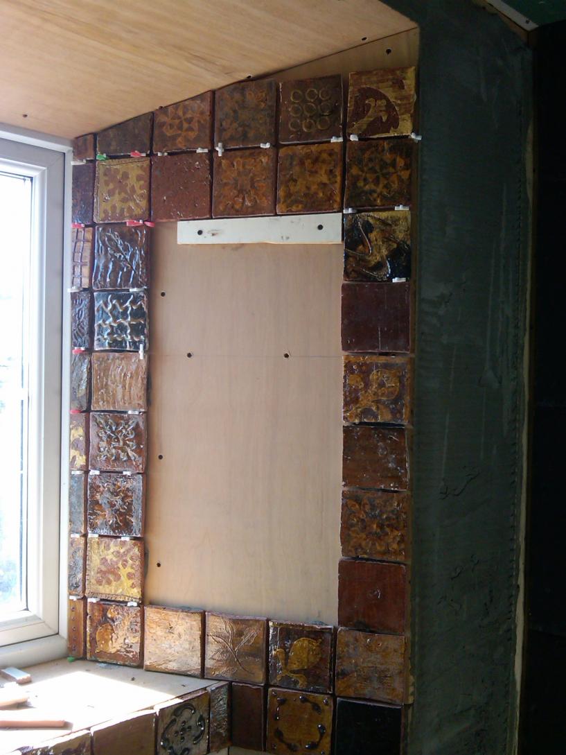 Hand made tiles were used as a frame for inset mirrors.