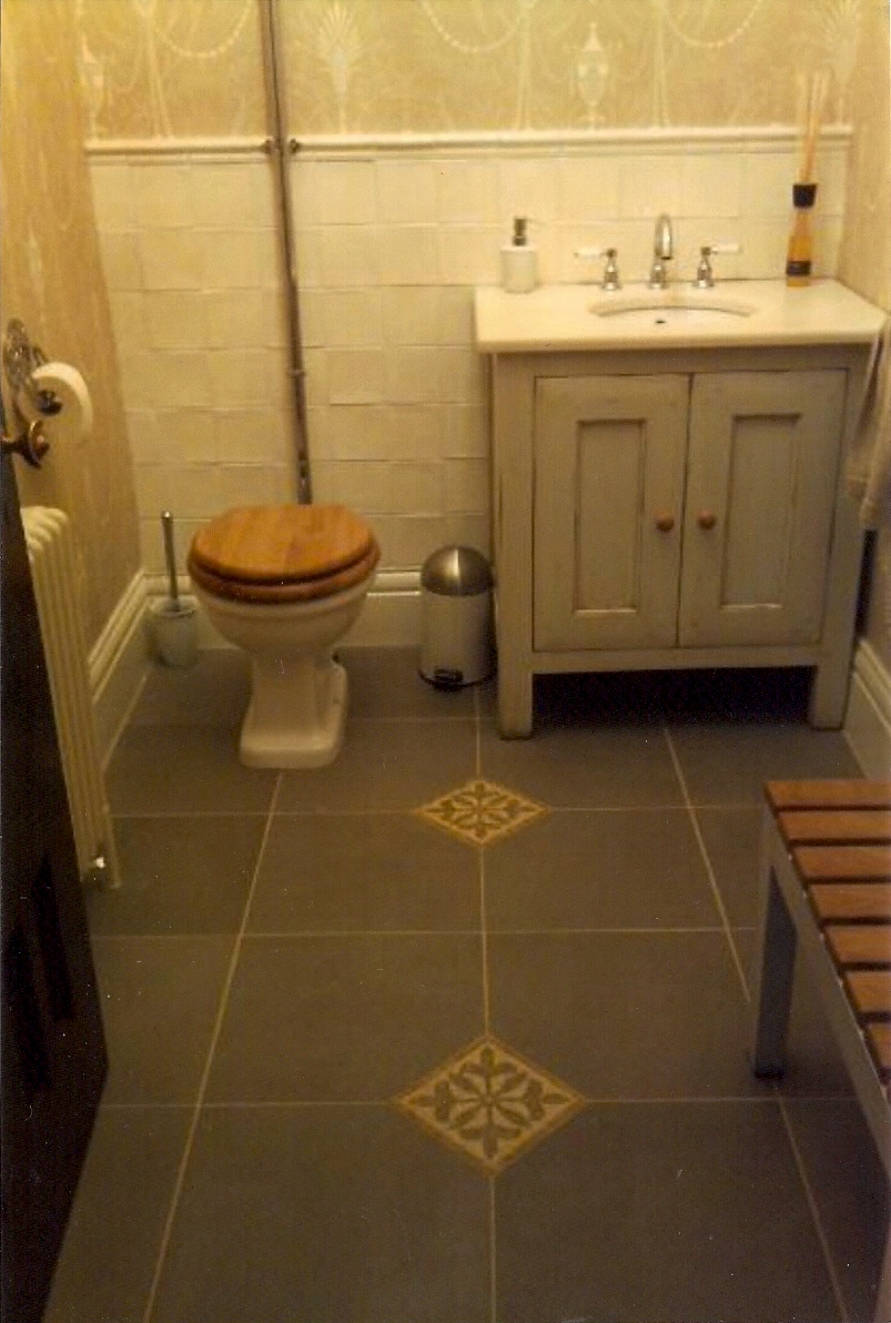 Hand made wall tiles FE.
FE floor tiles with mosaic insets.