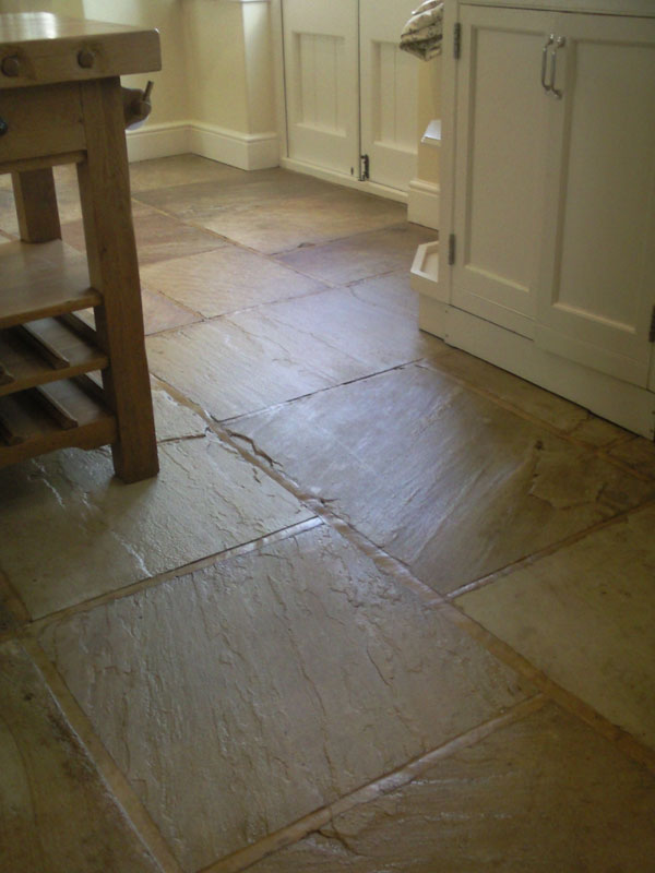 Indian Sandstone floor.  Cleaned for years with Flash / Daz/ Bleach left this floor getting dirtier and dirtier.  The sealant had been stripped by the careful cleaning using these products.  We degreased, deep cleaned and then sealed it using a strong surface sealant.