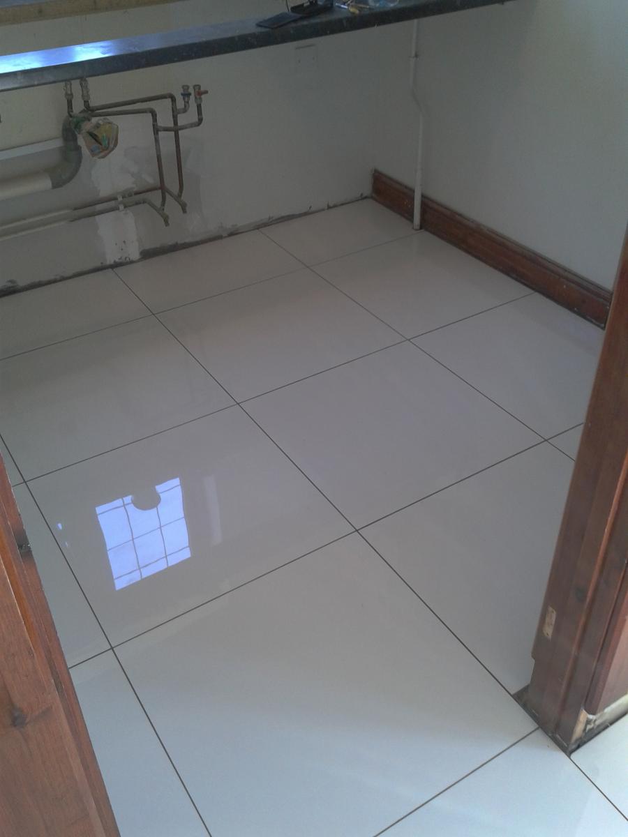 Kitchen Floor Tiling in Ashford Kent.
600 x 600 White Polished Porcelain.