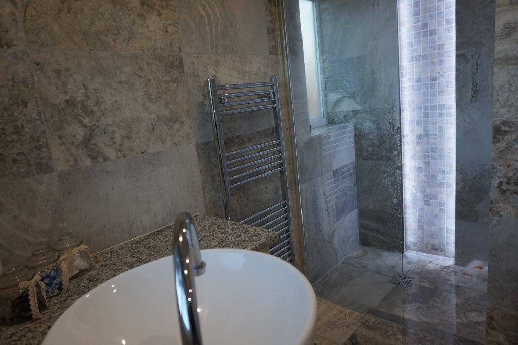 Marble bathroom shower end