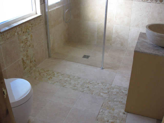 May 2009 Sandstone pebble mosaic = real pain to grout!