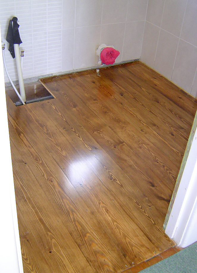 new floor, lightly sanded, stained (Rustins) and varnished (Bona Mega..4 coats) mmmm, shiny!