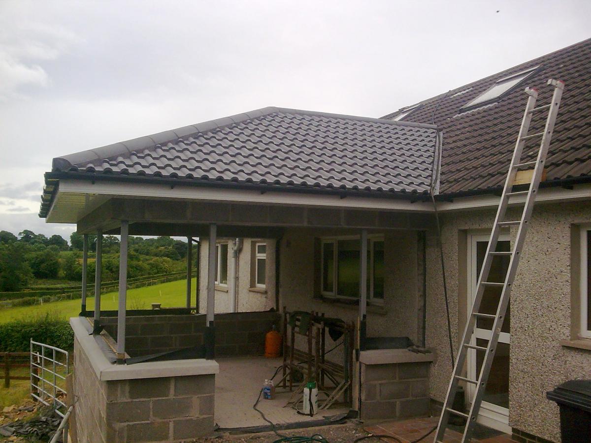 New sun room extension with head installed. Note state of old roof tiles.