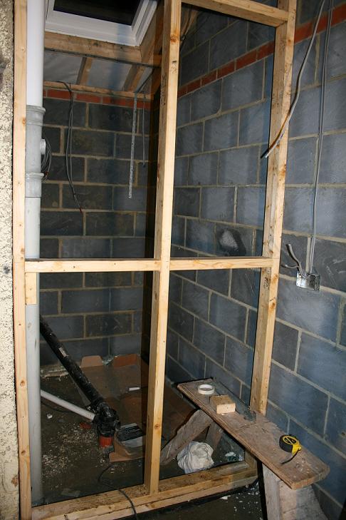 Partition wall seperating wetroom from kitchen.
Left side wall to be knocked through to create walk in area from bathroom.