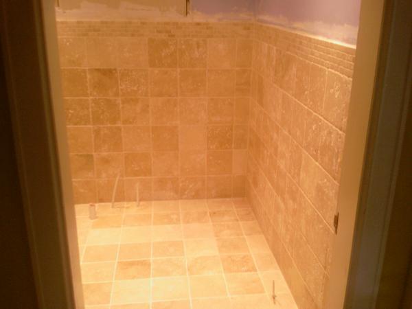 Photo 0097 200x200 unfilled travertine with mosaic border.