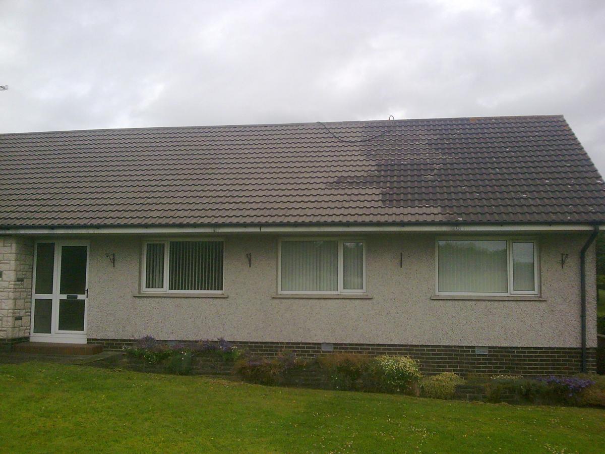 Powerhosing down the old roof tiles, old front door