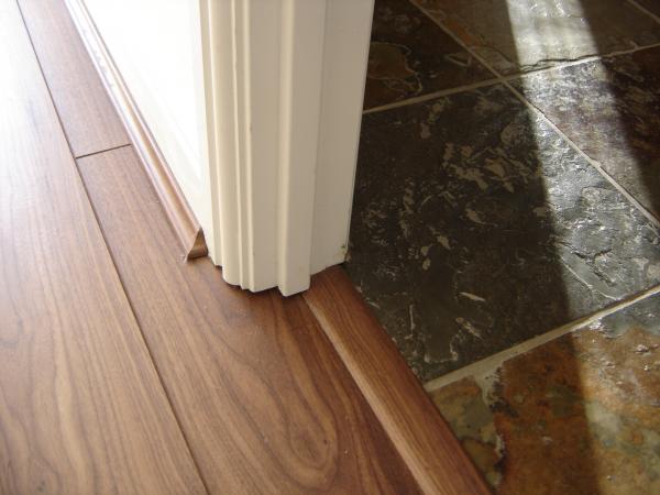 Rustic slate floor, and Quickstep 950 walnut flooring