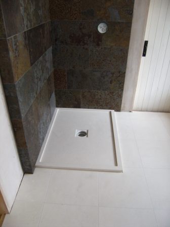 shower walls in slate with limestone tray