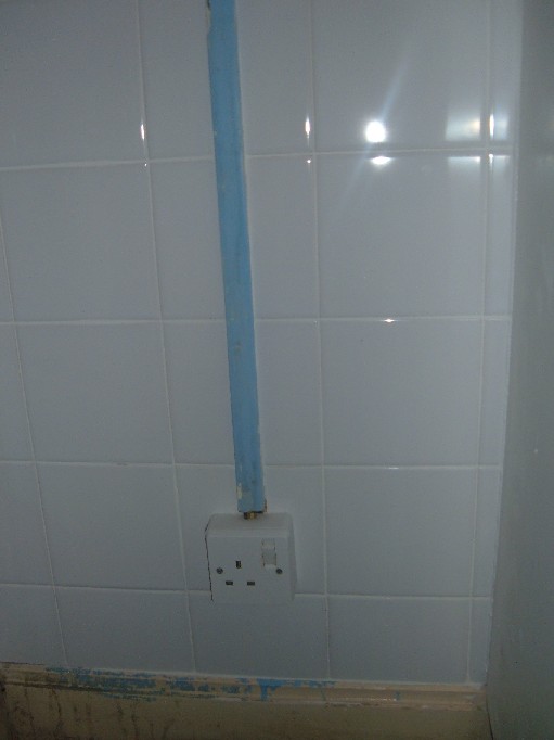 Socket cleaned and conduit tiled around.