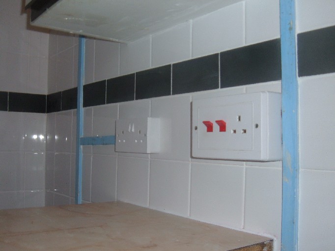 Tiled around conduit but sockets removed and miunted on tiles