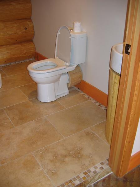 Travertine floor and border in a Log House