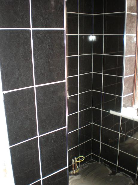 wetroom walls through door by www.firstpremiertiling.co.uk